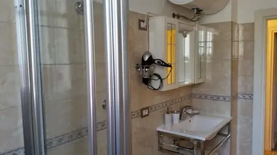 a bathroom with a sink and a shower at Andreina a San Pietro Apartment in Rome