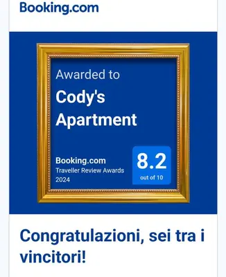 a picture of a gold picture frame on a blue background at Cody's Apartment in Rome