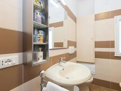 a bathroom with a sink and a toilet at Apartment Regina's House - St Peter by Interhome in Rome