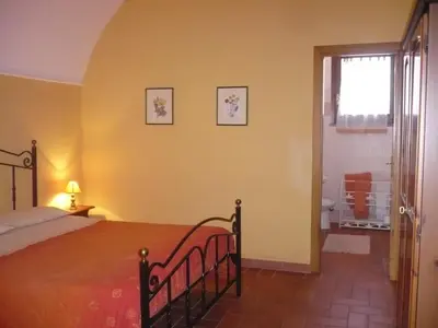a bedroom with a large bed and a window at Il Baffetto B&B in Rome