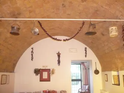 a room with an arch with beads hanging from the ceiling at Il Baffetto B&B in Rome