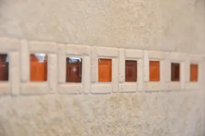 a brick wall with many windows on it at Your Rhome in Rome