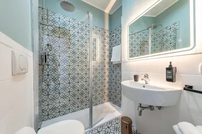 a small bathroom with a toilet and a sink at Crescenzio 74 Boutique Guest House by Ghor in Rome