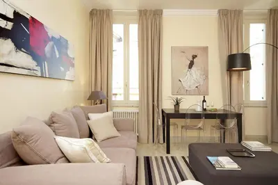 a living room with a couch and a table at Crispi Luxury Apartments - My Extra Home in Rome