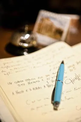 a pen sitting on top of a piece of paper at B&B La Scalinatella in Rome