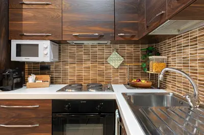 a kitchen with a sink and a microwave at Next Stop St Peter Rome in Rome