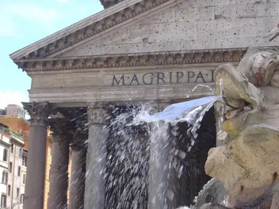 a water fountain in front of a building at Aquarius Inn in Rome