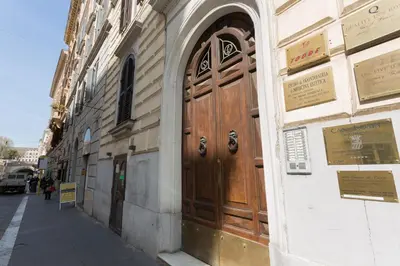 a large wooden door on the side of a building at Quality in Rome in Rome
