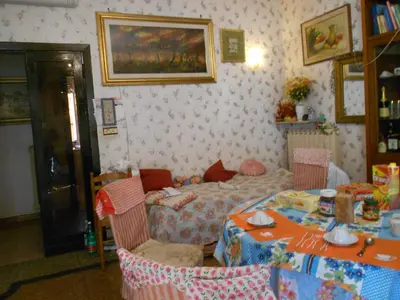 a room with a table and a bed in it at Sidereus in Rome