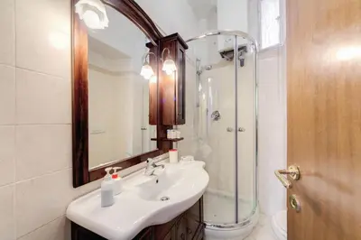 a bathroom with a sink and a shower at Casa Monticelli in Rome