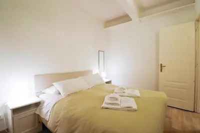 a bedroom with a bed with two towels on it at Locanderia Roma in Rome