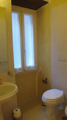a bathroom with a toilet and a sink at B&B In Piazza in Rome