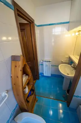 a bathroom with a toilet and a sink at Bed & Breakfast A Casa di Lia a Roma in Rome