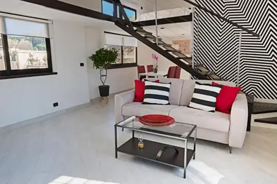 a living room with a couch and a table at Erida Apartment Spanish Steps in Rome