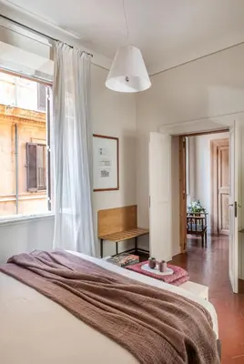 a bedroom with a bed and a window at MyNavona in Rome