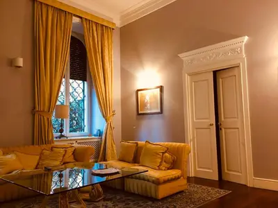 a living room with a couch and a table at Luxury House Belle Arti Rome City Center in Rome