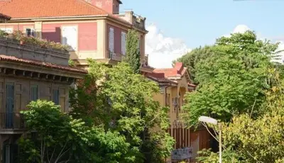 a group of houses with trees in front of them at B&B Villa Musa in Rome