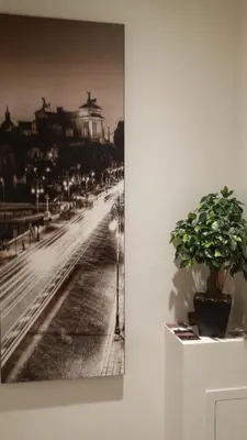 a black and white picture of a street with a building at Domus Barberini in Rome