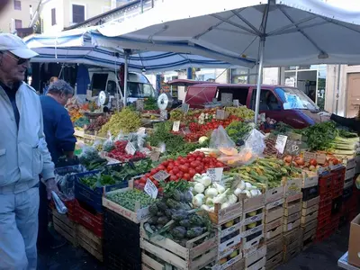 a market with a bunch of fruits and vegetables on display at Appartamento Isabella in Rome