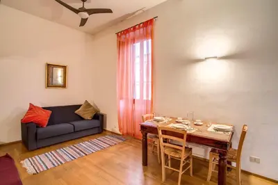 a living room with a table and a couch at Ponte Testaccio Loft in Rome
