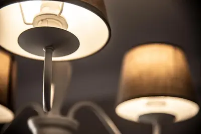 a close up of two lights on a ceiling at San Pietro Holidays in Rome