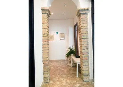a view of a hallway with a brick wall at Casa Alberone in Rome
