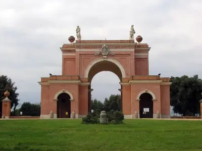 a building with an arch in the middle of a field at A Casa di Pe' Casa Vacanze in Rome