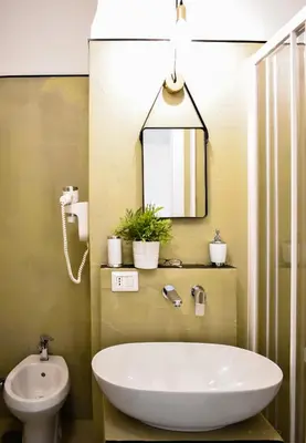a bathroom with a white tub and a sink at Bibi e Romeo's Home in Rome