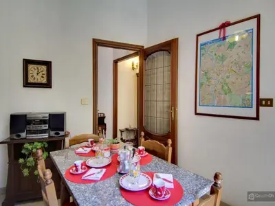 a dining room table with red napkins on it at Oltre le Mura in Rome