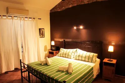 a bedroom with a bed with two teddy bears on it at Sixtythree guesthouse in Rome