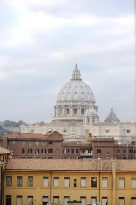 a view of a building with a cathedral in the background at La Casa Romana in Rome