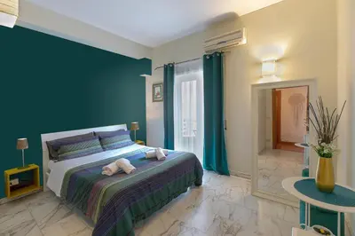 a bedroom with a bed with two stuffed animals on it at BB Danilo in Rome