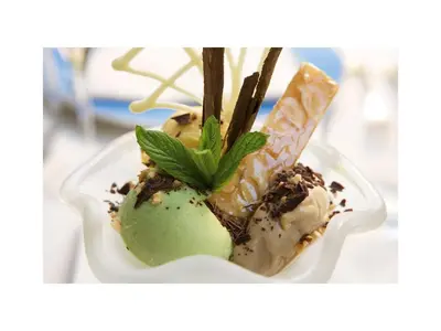 a dessert with ice cream and a green apple at Hotel Quirinale in Rome