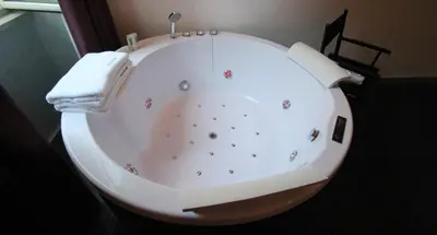a white bath tub with a towel on top of it at Magenta Pantheon Navona in Rome