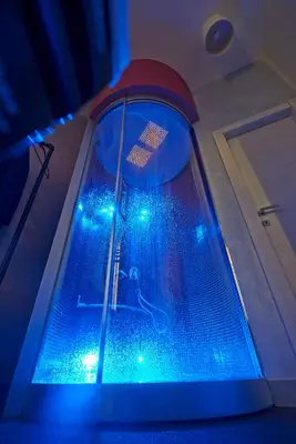 a swimming pool with blue lights in a room at Magenta Pantheon Navona in Rome