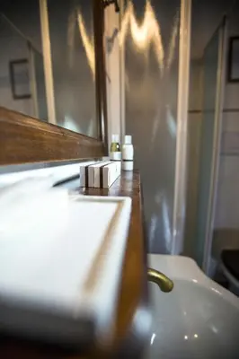 a bathroom with a sink and a mirror at Pettinary Village B&B in Rome