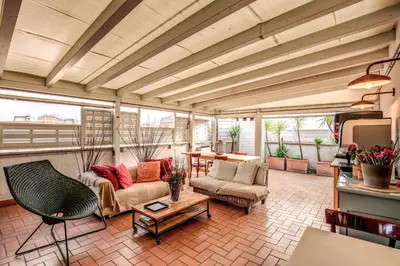 a living room with two couches and a table at City Guest House in Rome