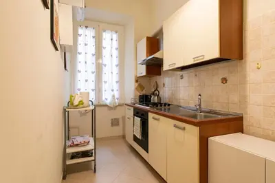 a small kitchen with a sink and a stove at Giulio Cesare Imperatore in Rome