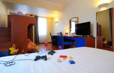 a hotel room with a large bed and a television at Best Western Hotel Globus in Rome