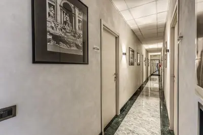 a corridor in an office building with a hallway at Hotel Planet in Rome