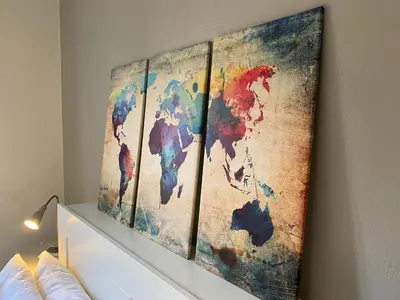a painting of a map of the world on a wall at Guest House Rome by GHOR in Rome