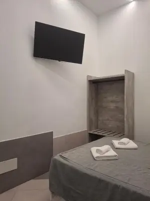 a room with a bed with two white towels on it at Hotel Viennese in Rome