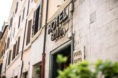 a sign for a store on the side of a building at Hotel Grifo in Rome