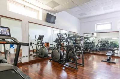 a gym with a bunch of exercise bikes in it at Belstay Roma Aurelia in Rome