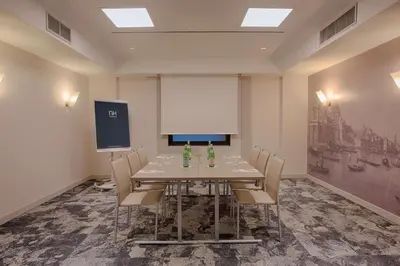 a conference room with a table and chairs at NH Roma Villa Carpegna in Rome