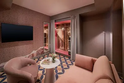 a living room with a couch and a table at nhow Roma in Rome