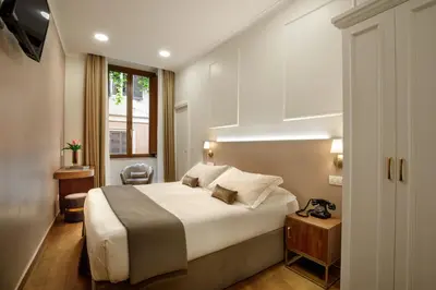 a hotel room with a bed and a window at Hotel Forte in Rome