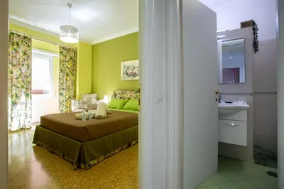 a bedroom with a bed and a sink in a room at Vatican Station in Rome