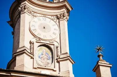 a clock tower on top of a building at All'Orologio in Rome