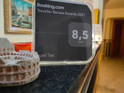 a digital clock on a counter next to a basket at Hotel Teti in Rome